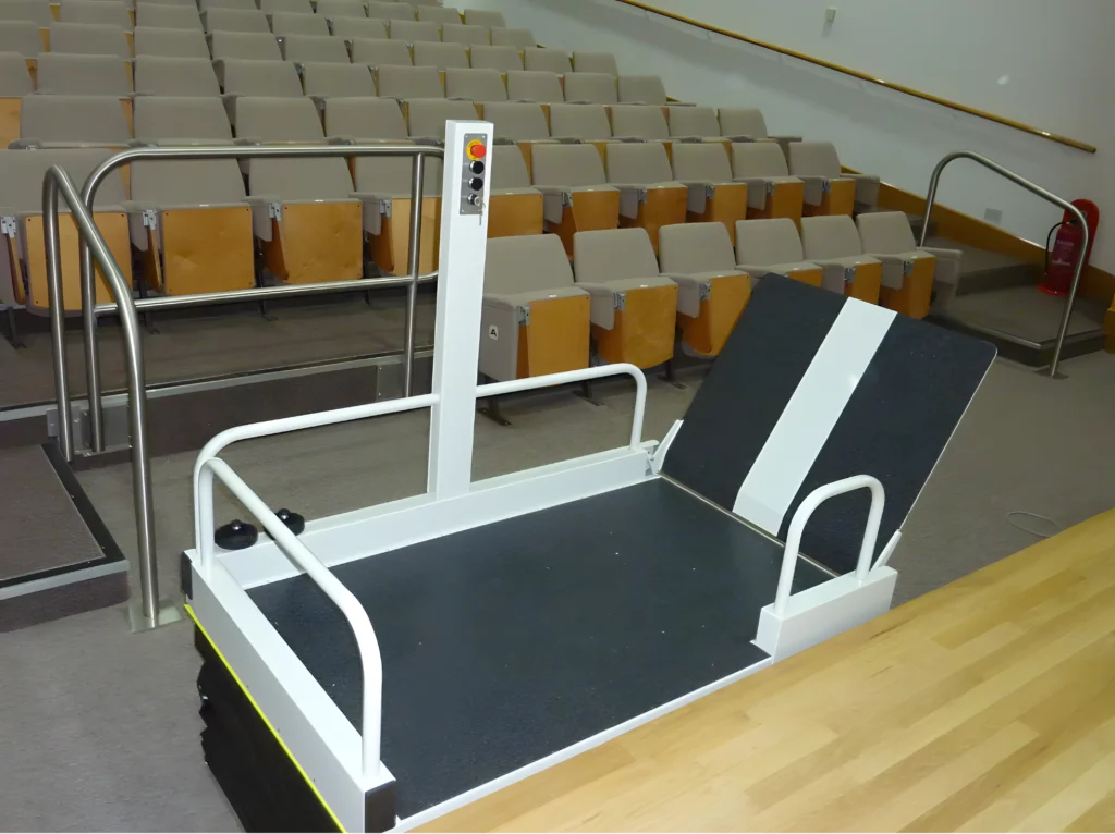 Liftboy 1 2 3 low-rise lifting platform beside an indoor stage